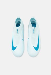 Light blue soccer shoes with a sleek design, featuring prominent dark blue Nike swooshes and a textured upper for grip and comfort.