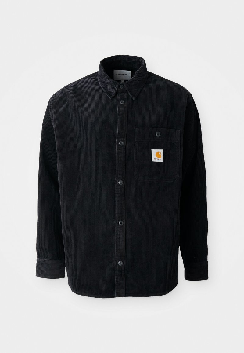 Zwarte corduroy lange mouw shirt met knoopsluiting, borstzak met een klein oranje Carhartt logo patch.