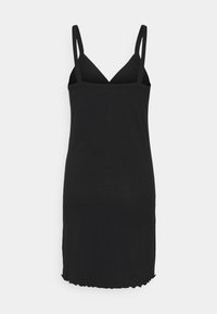 Robe mini noire sans manches en maille côtelée avec un col en V et de fines bretelles, ornée d'un ourlet légèrement volanté.