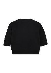 Felpa nera con scollo rotondo, maniche tre quarti e polsini a coste. Tessuto morbido, presenta una piccola etichetta sul lato.