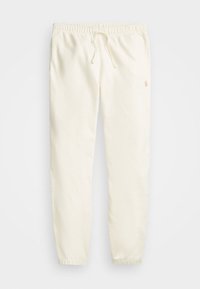 Krämfärgade joggerbyxor i mjukt tyg. Har resårmidja med dragsko och tapered fickor. Diskret logotypdetalj på sidan.