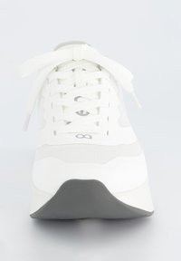 White sneaker with a textured mesh upper, flat laces, and a grey rubber sole; streamlined design with reflective accents at the tongue.
