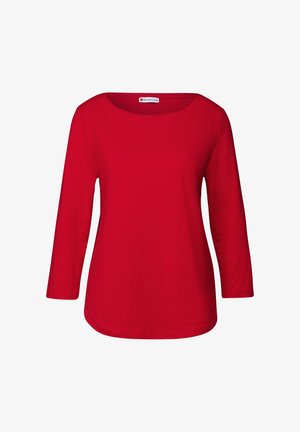 Camiseta roja de manga larga hecha de tela suave. Presenta un escote amplio y un dobladillo redondeado. Color sólido y simple, sin patrones ni adornos.