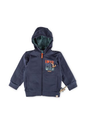 Felpa zip con cappuccio di colore blu navy, foderata con un motivo verde, stampa "Into the Wild" sul davanti, due tasche anteriori e un cursore a forma di dinosauro.