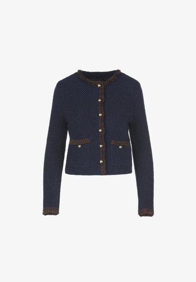 Navy blue knitted cardigan with long sleeves, featuring a fringed brown trim, gold-tone buttons, and two front pockets.