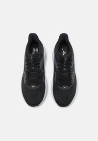 Black running shoes with a textured mesh upper, white sole, and black laces. Featuring a subtle logo and streamlined design elements.