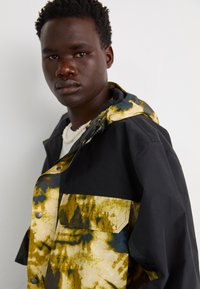 The North Face M66 RIPSTOP RAIN JACKET - Outdoorjacke - midnight petrol/black