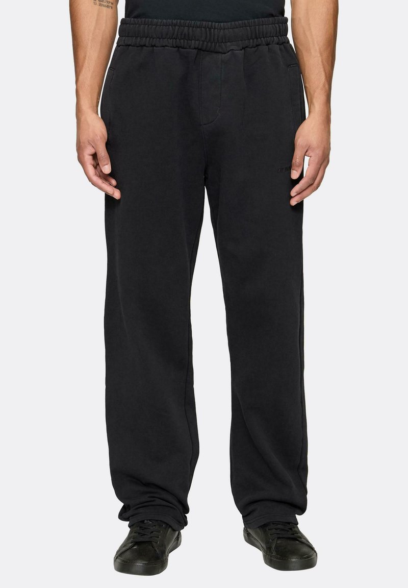 Juodi sportiniai kelnes, pagamintos iš minkštos medžiagos, su elastinga juosmens juosta, šoninėmis kišenėmis ir laisvu, tiesiu kirpimu.