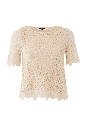 Top in pizzo color crema con maniche corte, caratterizzato da intricati motivi floreali, bordi smerlati e una vestibilità comoda.