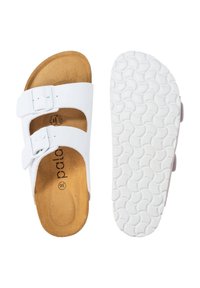 Sandalias blancas con dos correas ajustables, plantillas marrones texturizadas y una suela de goma blanca flexible con un patrón circular. Talla 36.