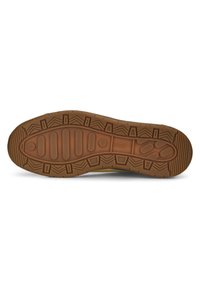 Semelle de chaussure en caoutchouc avec une surface brune texturée, présentant un motif géométrique et des rainures pour l'adhérence.