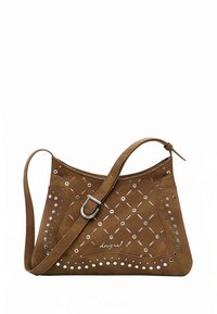 Brown suede handbag with a curved shape, decorative cut-outs, silver hardware, and stud accents. Features an adjustable shoulder strap.