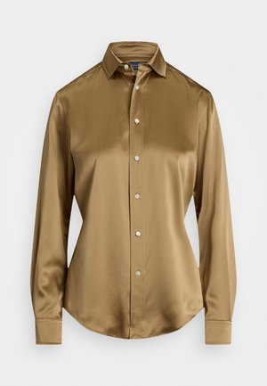 Brown satin shirt with a pointed collar, long sleeves, and button front. Features a curved hem and smooth texture. Front buttons are silver.