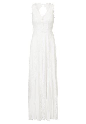 Biała sukienka koronkowa z bezrękawowym fasonem, głębokim dekoltem w kształcie litery V oraz odkrytymi plecami. Posiada skomplikowane wzory koronkowe oraz zwiewną spódnicę.