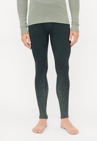 Sorte tights med en gradientdesign som går over til mørkegrønn ved anklene, laget av et glatt, elastisk materiale. Har en tettsittende stil.