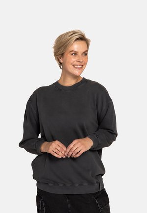 Dunkelgrauer Pullover aus weichem Stoff mit Rundhalsausschnitt, überschnittenen Schultern sowie gerippten Bündchen und Saum.