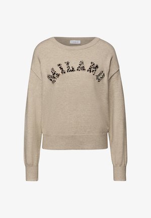 Beige trui met een losse pasvorm, ronde hals en geribbelde manchetten. Voorzien van "MILANO" versierd met een luipaardprint aan de voorkant.