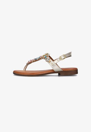 Sandal flat con una fascia metallica dorata e un'ornamentazione di gioielli decorativa in più colori; presenta una suola in sintetico marrone.