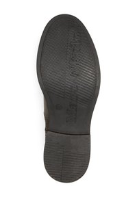 Semelle de chaussure en caoutchouc noir avec une texture adhérente, arborant le nom de la marque "Marc O’Polo" gravé en relief de manière proéminente. Bords arrondis et lisses.