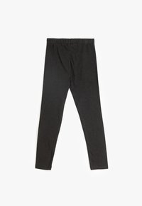 Svarta leggings tillverkade av mjukt, stretchy tyg. Har en elastisk midja och en åtsittande design som smalnar av mot anklarna.