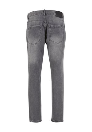 Grijze jeans met een slim fit, voorzien van een klassiek vijf-pocket ontwerp en een gestructureerde tailleband. De achterzijde toont lichte vervaging op de stof.
