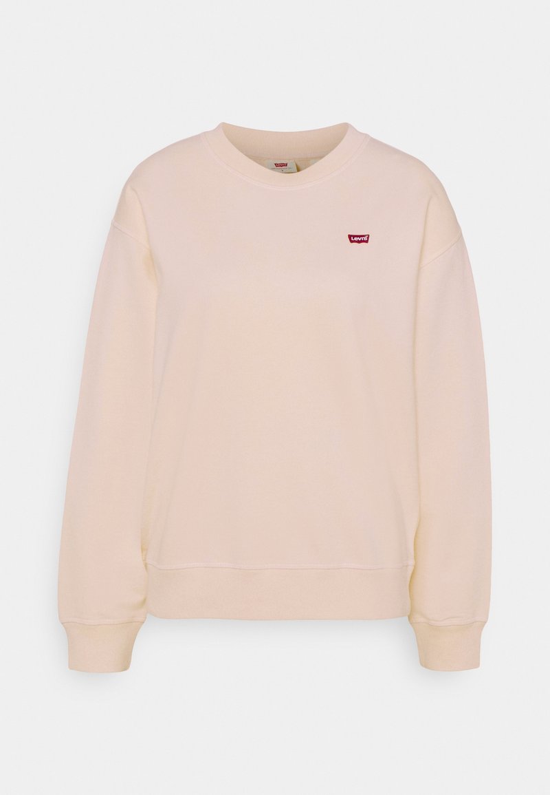 Sweatshirt beige clair en tissu doux. Il possède un col rond, des manches longues et un petit logo rouge Levi's sur la poitrine.