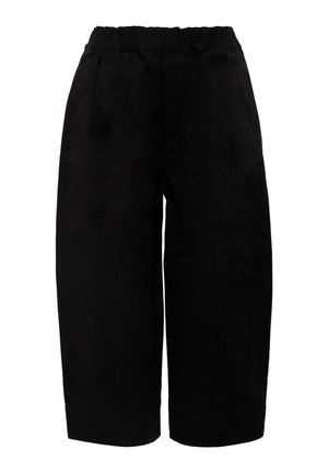 Pantalons larges noirs avec une taille élastique, présentant une texture lisse et des poches latérales, conçus pour le confort et la facilité de port.
