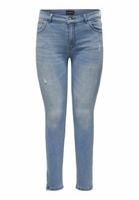 Svetlomodré úzke džínsy s bledým vzhľadom a malými poškodenými detailmi. Majú zapínanie na gombík a zips, päť vreciek a pútka na opasok.