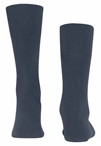 Marine Crew-Socken mit geripptem Bündchen, glatter Textur und leicht tailliertem Knöchel. Hergestellt aus einem dehnbaren Material für zusätzlichen Komfort.