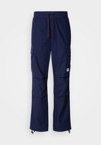 Navy blue cargo pants made from textured fabric; features include an elastic waistband, drawstring, and multiple side pockets.