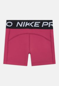 Ružové športové šortky s čiernym elastickým pásom, na ktorom je v bielej farbe napísané "NIKE PRO". Hladký materiál a priliehavý strih pre maximálne pohodlie.