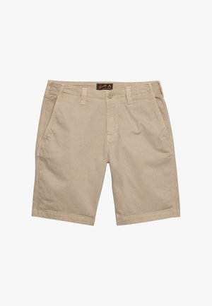 Beżowe, casualowe spodenki do kolan z przednimi kieszeniami, szlufkami na pasek, zapięciem na guzik oraz małą metką marki na środku talii.