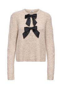 Neulottu beige neuletakki pyöreällä pääntiellä, jossa etuosassa kaksi mustaa satiininauhaa. Pitkät hihat ja resorikuvio.