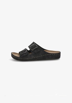 Las sandalias de ante negro tipo slide cuentan con dos correas ajustables con hebillas de metal, una plantilla acolchada y una suela de plataforma elevada.