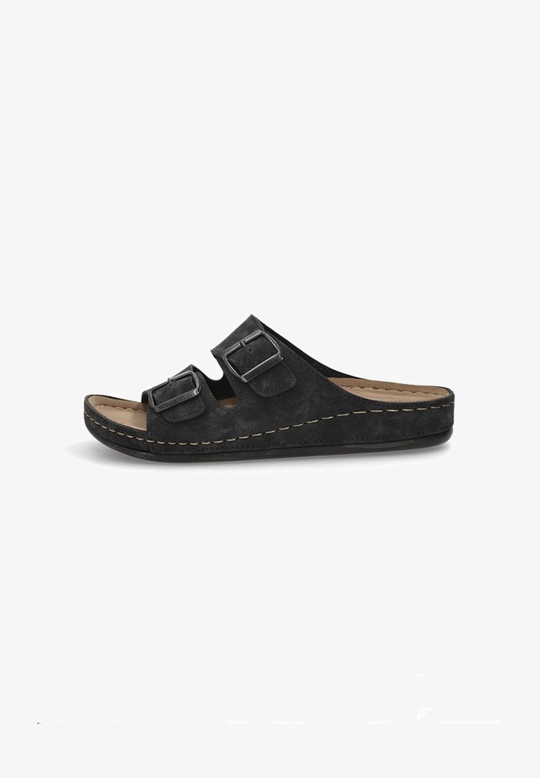 Las sandalias de ante negro tipo slide cuentan con dos correas ajustables con hebillas de metal, una plantilla acolchada y una suela de plataforma elevada.