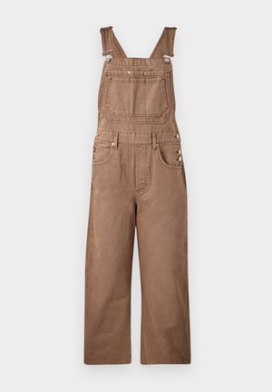 Smeđi traper overall sa podesivim naramenicama, prednjim džepom i bočnim kopčama. Dizajniran s širokim nogavicama i teksturiranim završetkom.