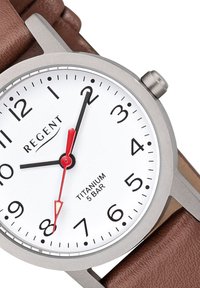 Titanium wristwatch with a white dial, black numerals, and red second hand. Brown leather strap textured with a subtle pattern.