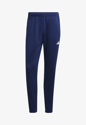 Pantalon de sport bleu marine avec taille élastique et jambes fuselées, avec un petit logo Adidas blanc sur la partie supérieure de la cuisse gauche.