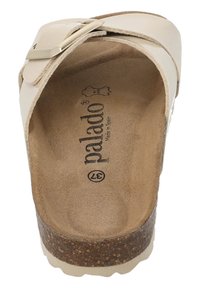 Beige faux leather sandal with a metallic buckle, cork sole, and textured footbed. Brand logo "palado" is visible inside.