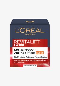 L'Oréal Paris Revitalift Laser anti-agingkrämens förpackning har en marinblå topp, röda accenter och vita etiketter med produktinformation i guld och svart text.