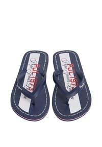Mornarsko modri natikači z teksturirano podlago, pri čemer imajo bele in rdeče črte ter blagovno znamko "Pepe Jeans". Oblika s trakovi med prsti. Lahka materiala.