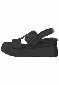 Black platform sandals with a sleek, curved design, featuring a wide buckle strap, open toe, and a textured sole for grip.