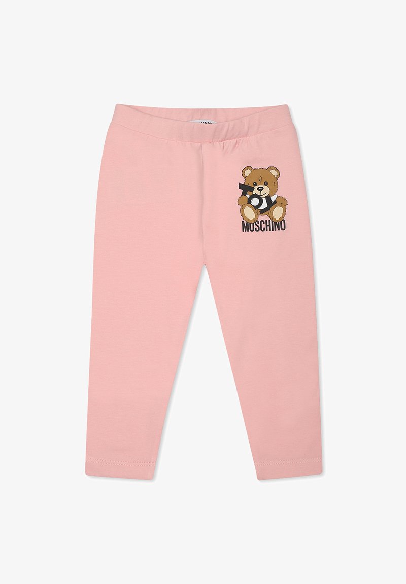 Roze leggings gemaakt van zachte stof met een elastische tailleband, met een cartoonbeerafbeelding en de merknaam "MUSCHINO" in het zwart.