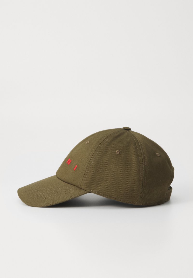 Olive green cap with a curved brim, featuring red embroidered text on the front. Made of cotton, it has a textured finish and ventilation eyelets.