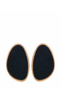 Shoe insoles featuring a navy blue perforated surface and a beige cork edge, oval shape, designed for comfort and support.