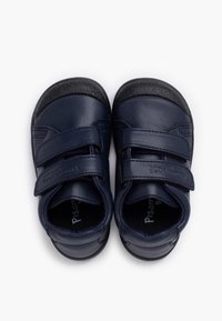 Navy leather toddler shoes with two adjustable Velcro straps, rounded toe, soft lining, and textured rubber soles for grip.