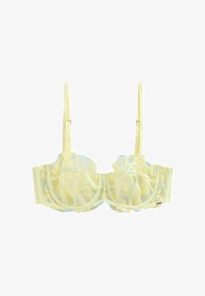 Keltainen pitsirintaliivit, joissa kukkakirjailu, kaaritukikupeissa, säädettävät olkaimet ja takana hakaskiinnitys.