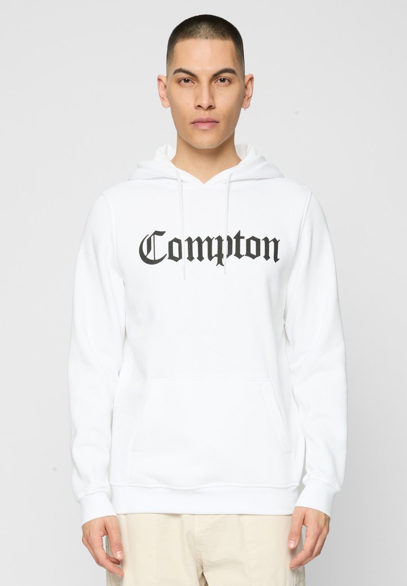 Felpa bianca in cotone con tasca frontale, cappuccio con coulisse e testo "Compton" in nero, in un carattere bold e con grazie. Presenta polsini e orlo a costine.