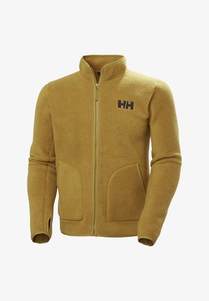 Fleeceová bunda v hořčicově žluté barvě s vysokým límečkem, předním zipem a dvěma velkými kapsami. Na hrudi se nachází kontrastní tmavé logo.