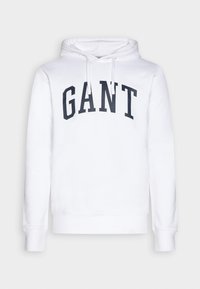 Weißer Kapuzenpullover aus Baumwolle mit einer Kängurutasche, verstellbaren Kordeln und dem Schriftzug "GANT" in Marineblau.